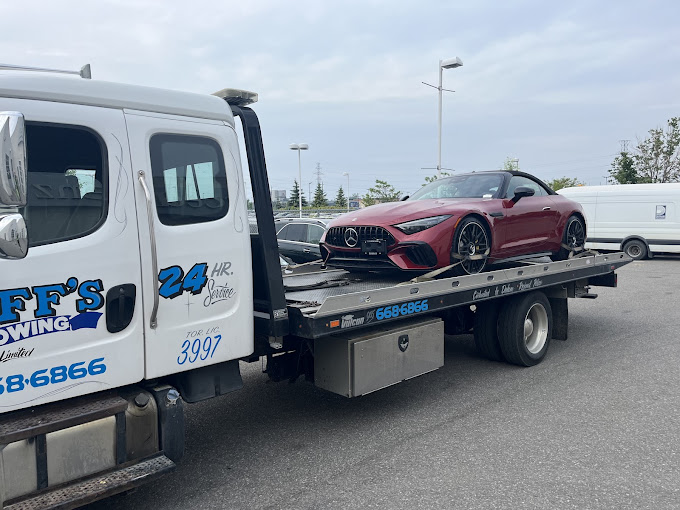Duff's Towing flatbed at work